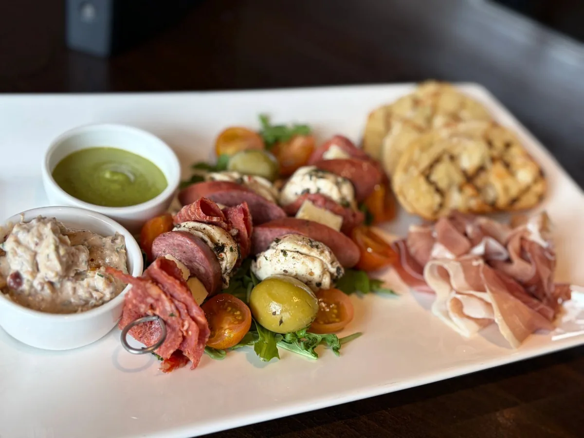 A shared plate of meats, cheese and bread at The Raven Bistro